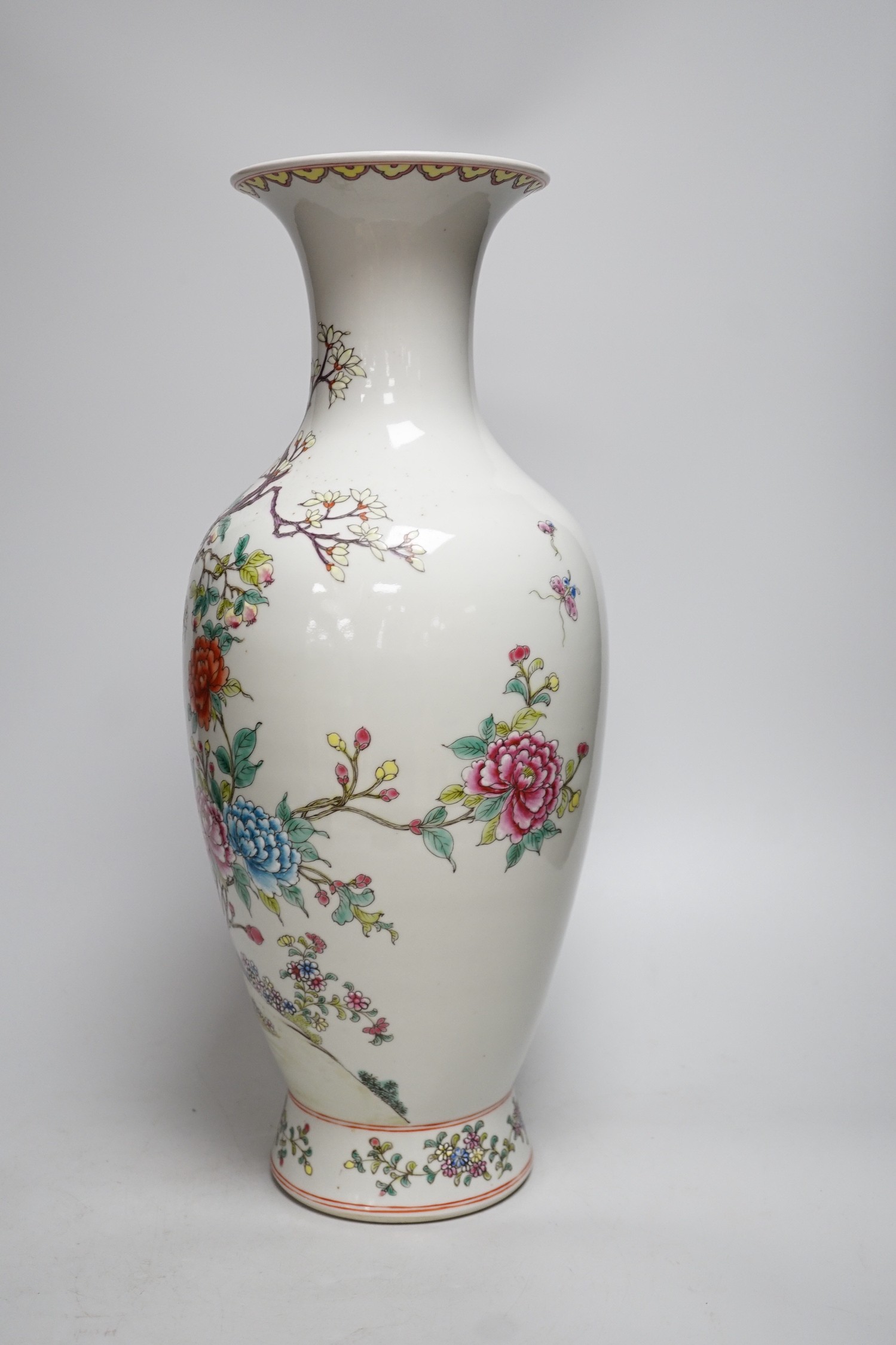 A large Chinese famille rose peacock vase. 46cm tall